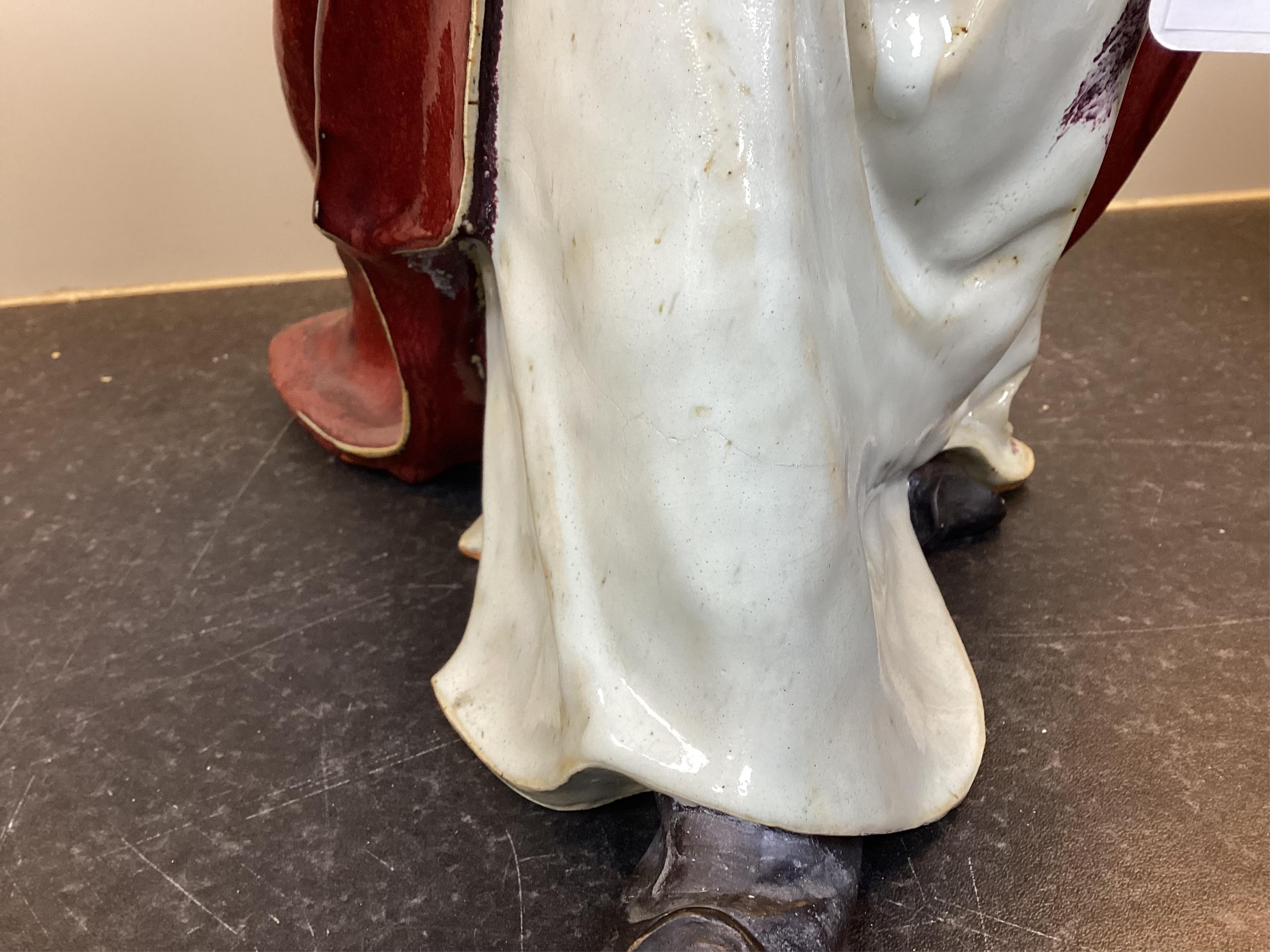 A large Chinese Shiwan stoneware figure of a warrior, 20th century